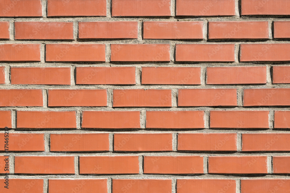 Brick wall background, texture of red stone blocks closeup Brick wall background, texture of red stone blocks closeup