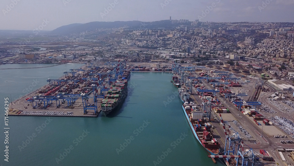 Fully loaded container ship docked at freight port terminal