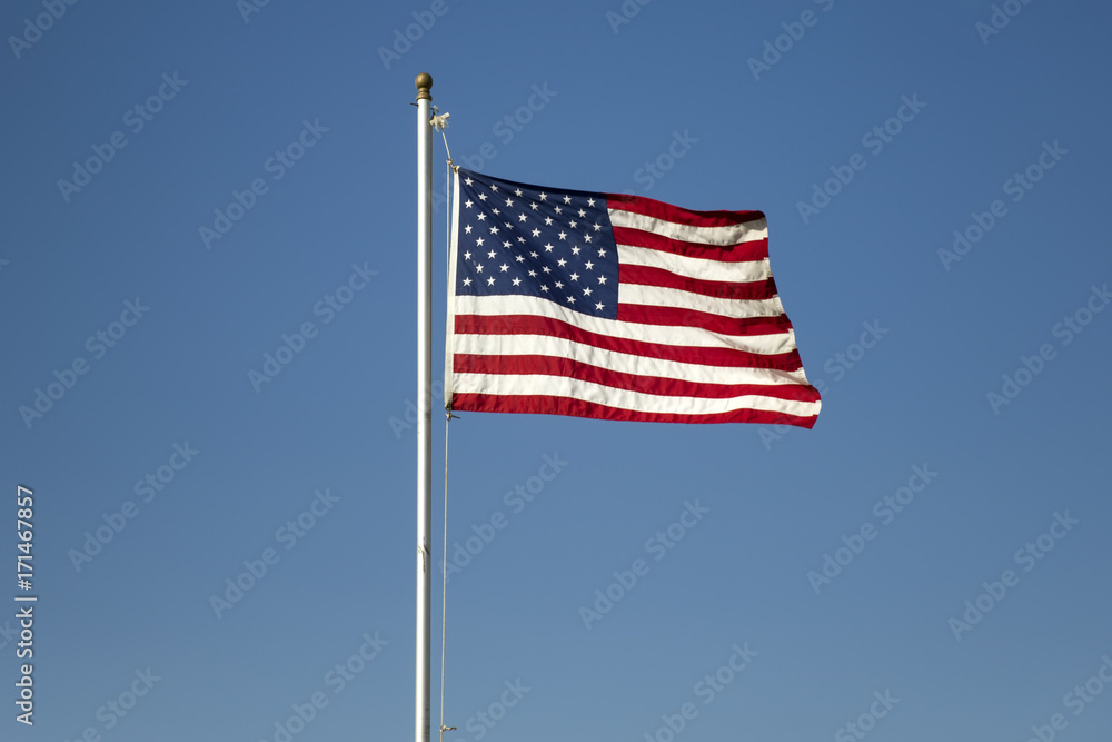 Fototapeta premium American flag on the blue sky