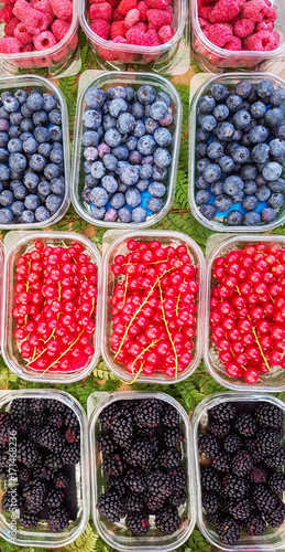 Raspberry, gooseberry and blueberries on market
