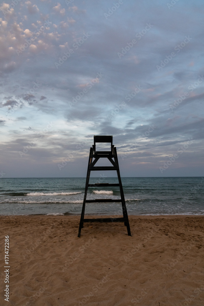 Lifeguard lookout in a lonely beach during sunset