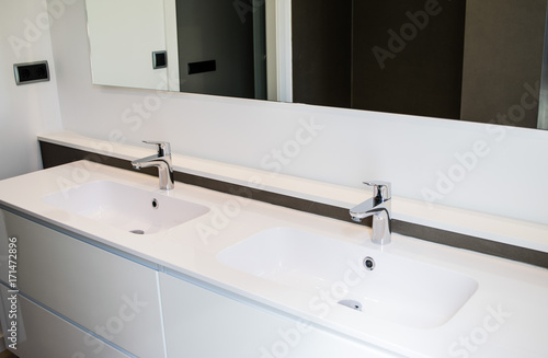 Two white sinks in the bathroom