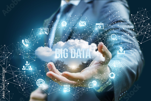 Businessman showing a cloud with the words big data .