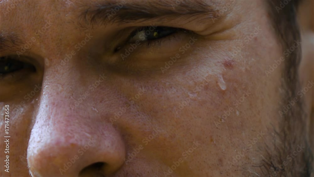 Epic extreme close-up shot. Eye and nose. sweat man outdoor in park. Drop of water on his face macro slow motion high-speed fps rapid camera. Epic extreme close-up shot. Eye and nose. sweat man outdoor in park. Drop of water on his face macro slow motion high-speed fps rapid camera.