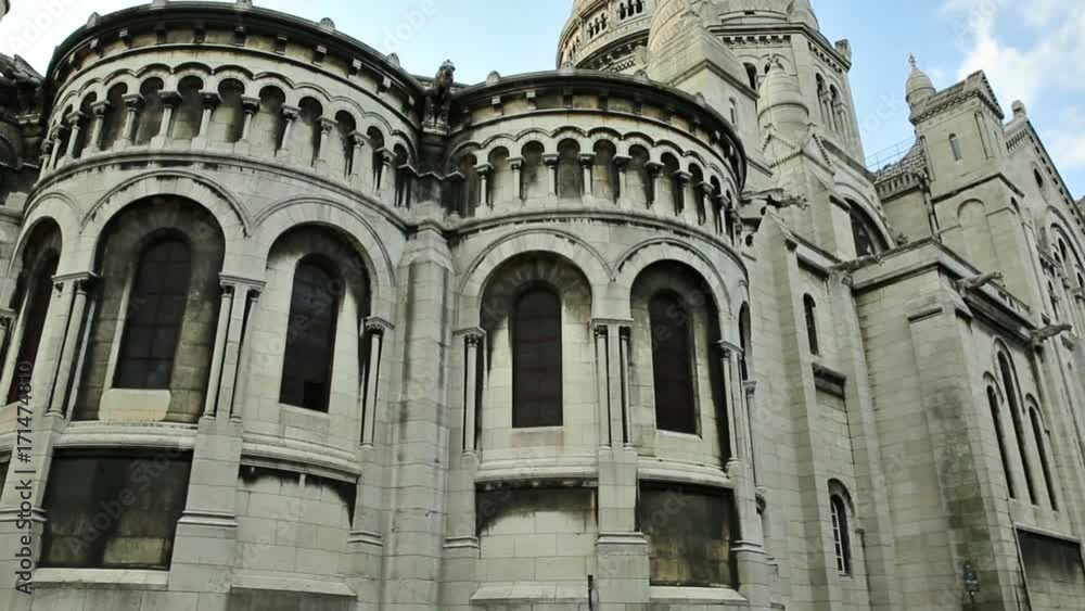 Hyperlapse turning around of the Sacred Heart of Paris church in France. Basilique du Sacre-Coeur de Montmartre, Historic district of Paris city in a blue cloudy sky. Hyperlapse turning around of the Sacred Heart of Paris church in France. Basilique du Sacre-Coeur de Montmartre, Historic district of Paris city in a blue cloudy sky.