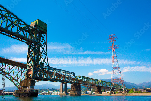Photo of train tracks next to Iron Worker's Memorial Bridge in Vancouver, BC