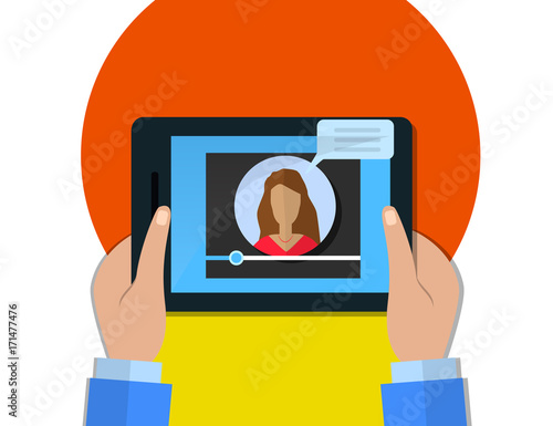 Hands holding tablet with video player on screen, female video blogger concept