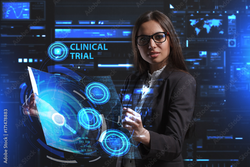 The concept of business, technology, the Internet and the network. A young entrepreneur working on a virtual screen of the future and sees the inscription: Clinical trial The concept of business, technology, the Internet and the network. A young entrepreneur working on a virtual screen of the future and sees the inscription: Clinical trial