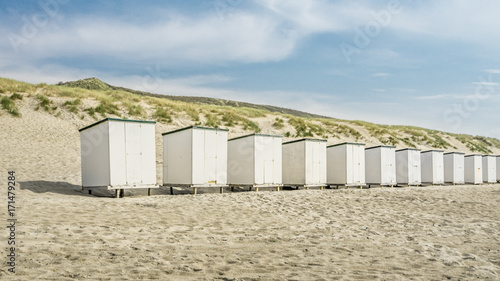 Row Of Huts On Beach Against Sky  © rosstek
