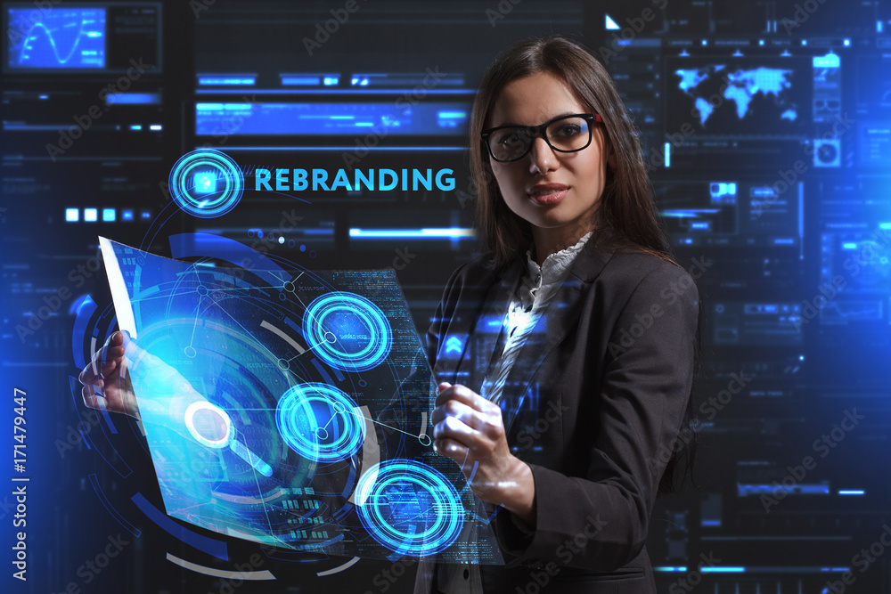 The concept of business, technology, the Internet and the network. A young entrepreneur working on a virtual screen of the future and sees the inscription: Rebranding The concept of business, technology, the Internet and the network. A young entrepreneur working on a virtual screen of the future and sees the inscription: Rebranding