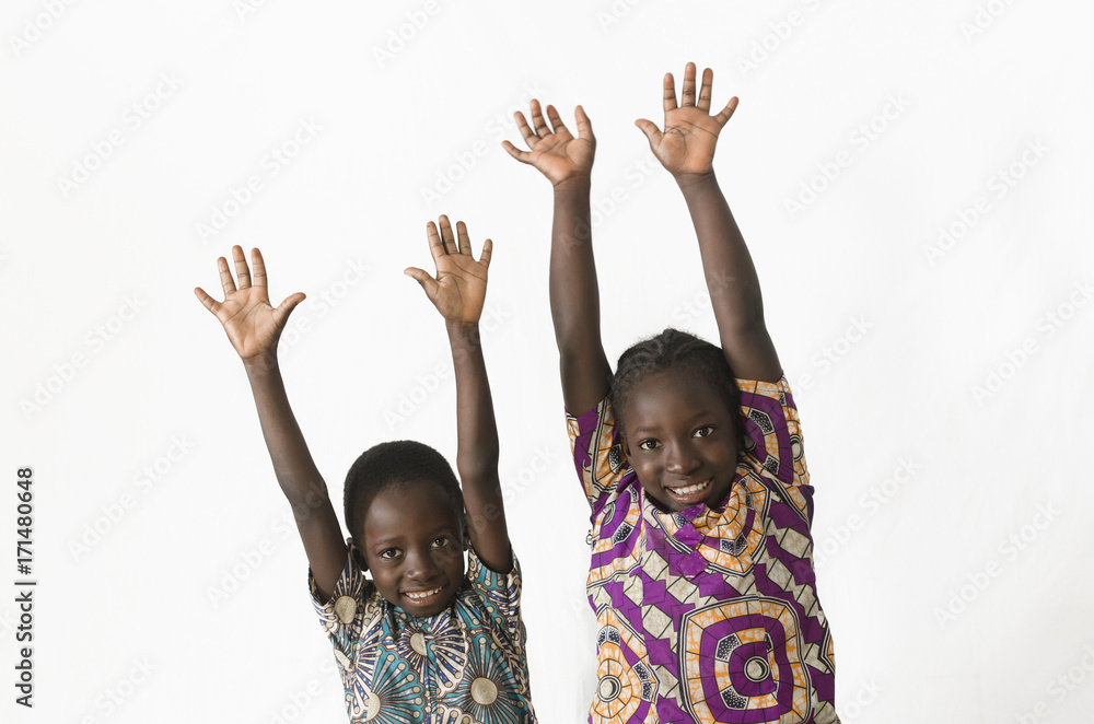 Two beautiful African children playing and having fun by showing their hands, isolated on white Two beautiful African children playing and having fun by showing their hands, isolated on white