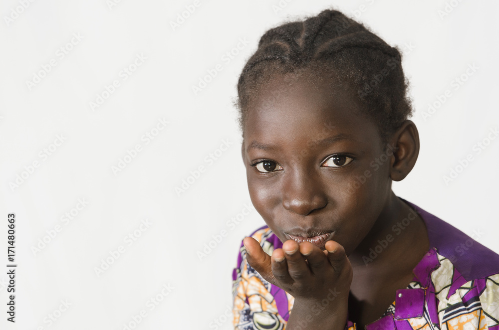 Beautiful African girl blowing a kiss, isolated on white Beautiful African girl blowing a kiss, isolated on white