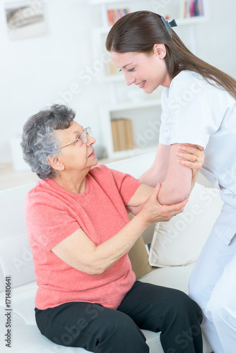 old lady with walking problem and her carer