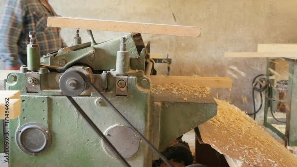 Gouging the wooden square beam on machine Gouging the wooden square beam on machine