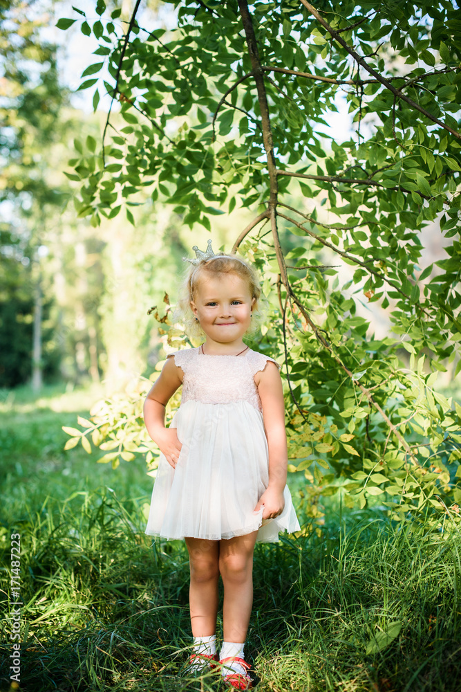 likable and Beautiful child in the summer. Green nature background likable and Beautiful child in the summer. Green nature background