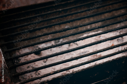 Charcoal grill / View of empty dirty charcoal grill. Dark tone.