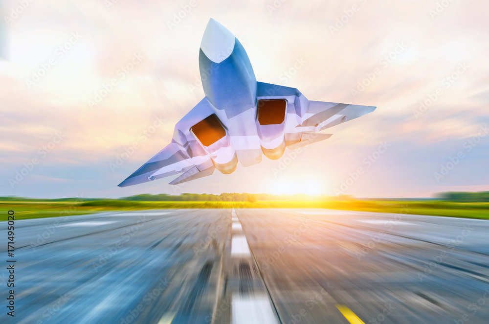 Fototapeta premium Military fighter jet flies at high speed over the taxiway at the airport