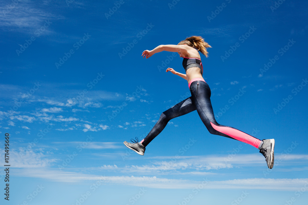 Sportswoman remains in air while jumping