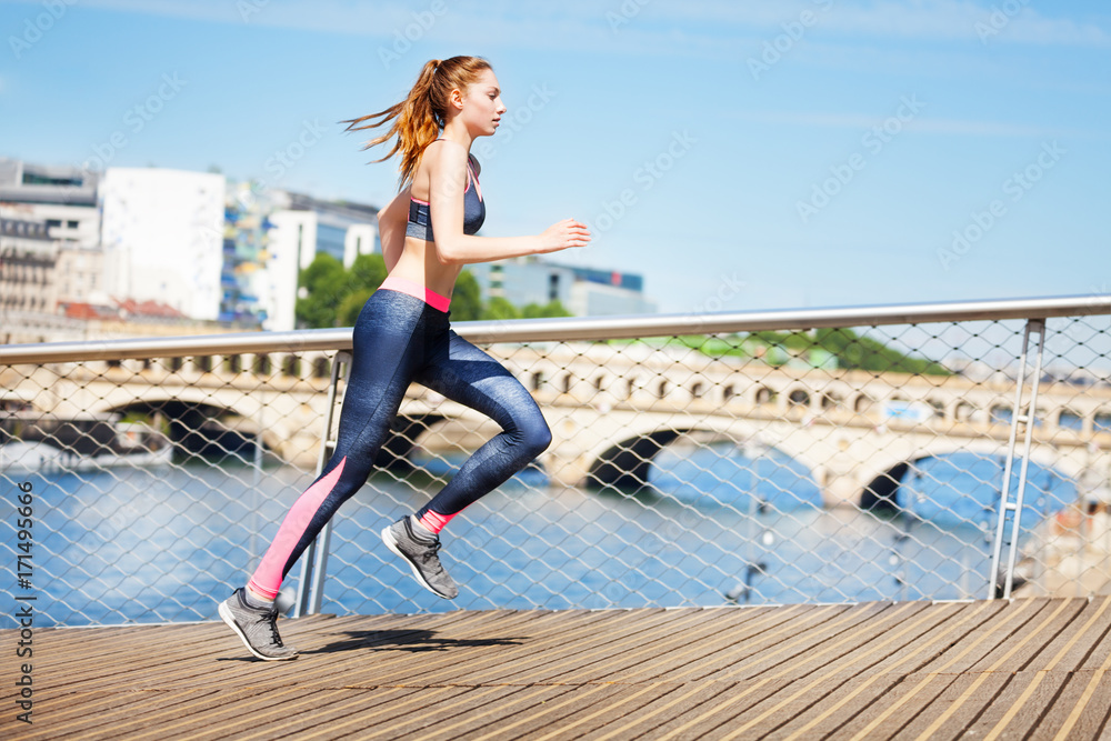 Sporty young woman on morning run Sporty young woman on morning run