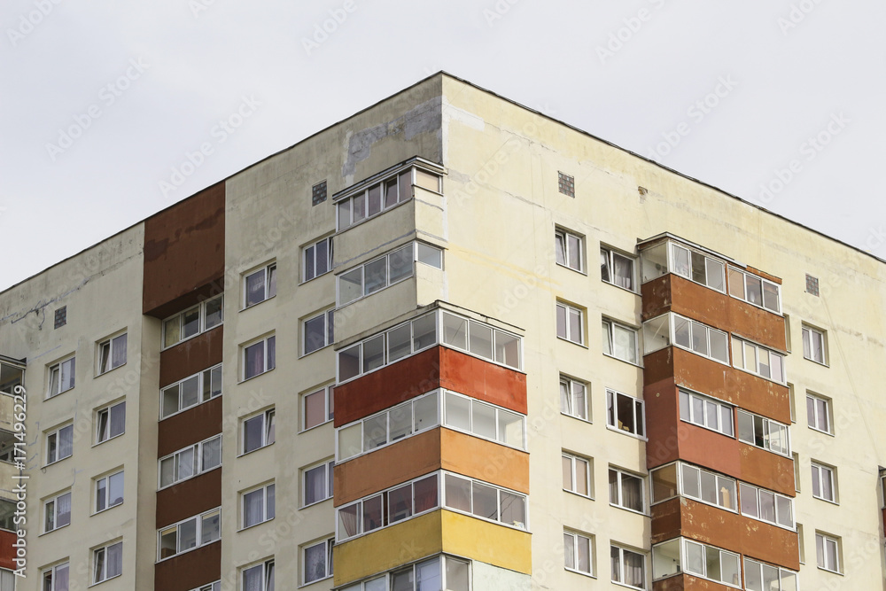 windows and balconies of a multi-storey building windows and balconies of a multi-storey building