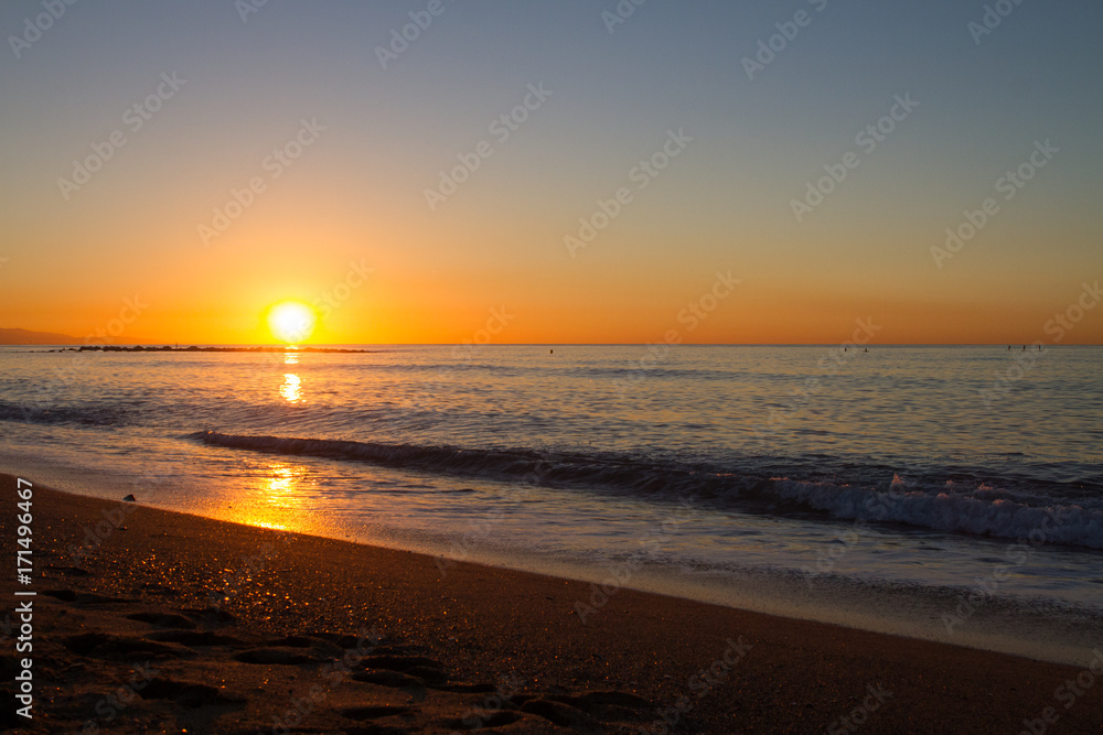 Barceloneta Beach in Barcelona with colorful sky at sunrise Barceloneta Beach in Barcelona with colorful sky at sunrise