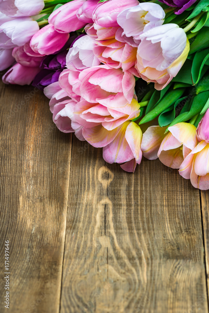 Close up of Bunch of Colorful Tulips on Wooden Background