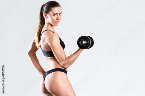 Beautiful woman with dumbbells.