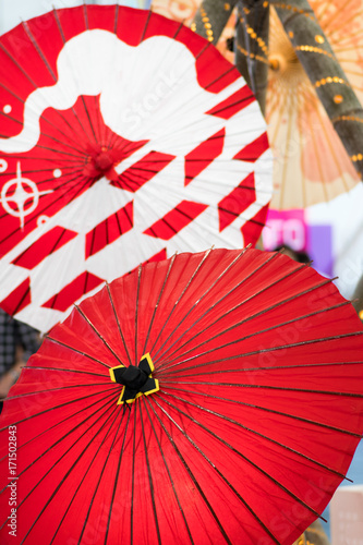 Two traditional japanese bambo paper umbrellas  red color.