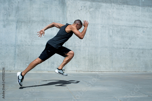 Young man fitness training outdoors