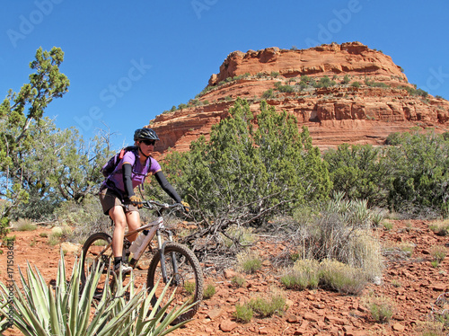 Woman mountain biking in the red rocks, Sedona, Arizona, USA