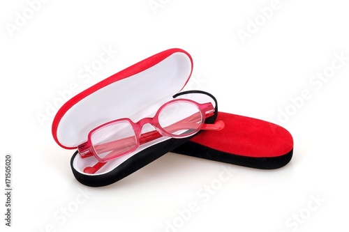 Fashionable plastic glasses in a velvet case on a white background