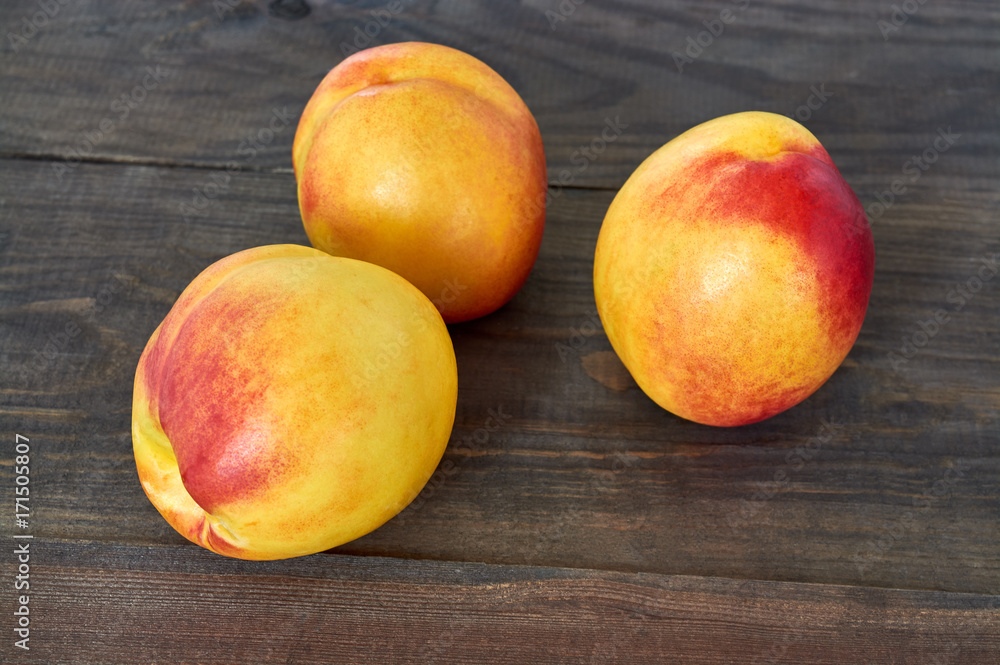 Fresh peaches on wooden background Fresh peaches on wooden background