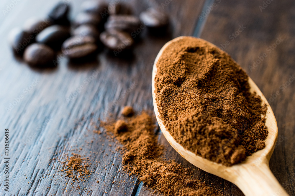 instant espresso powder in wooden spoon. instant espresso powder in wooden spoon.