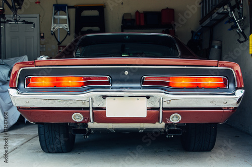 Tail ights on a vintage car in a garage photo