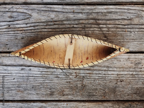 Miniature canoe made of birch bark photo