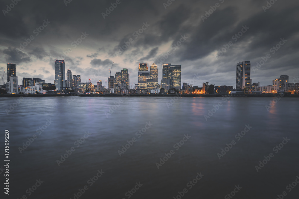 Rainy Clouds over Canary Wharf Skyscrapers in London, UK
