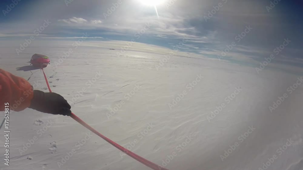 A point of view shot of a sled being pulled by a man. A point of view shot of a sled being pulled by a man.