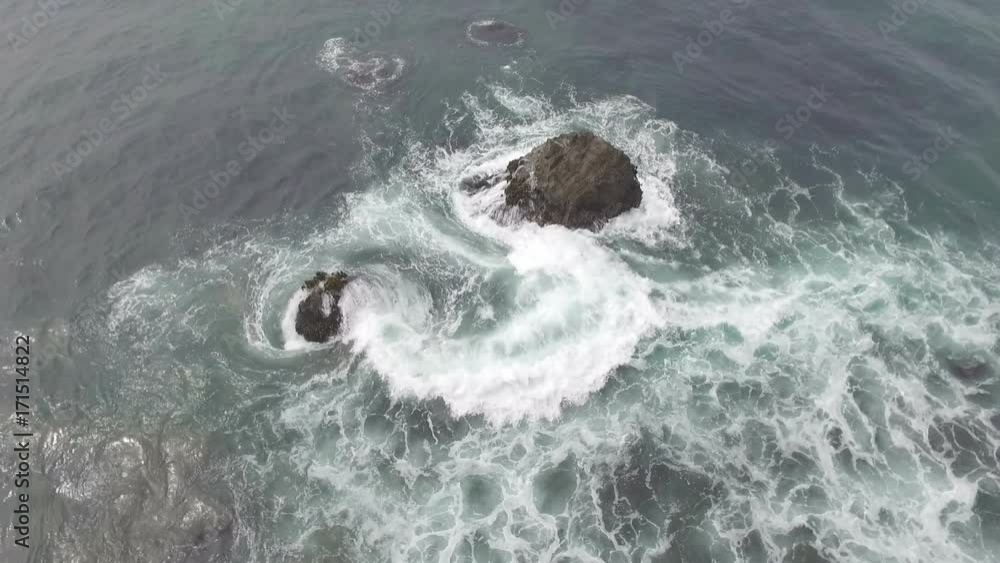 Aerial view of waves crashing on rocks along the west coast
Aerial view of waves crashing on rocks along the west coast