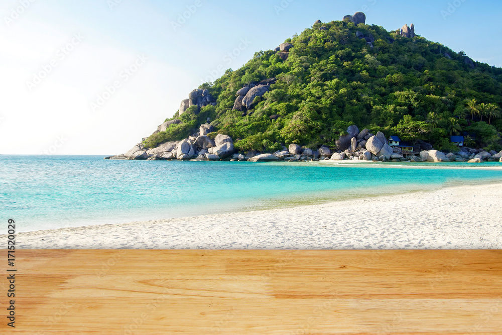 Obraz premium Wooden floor with white sand beach island and blur mountain hill background landscape