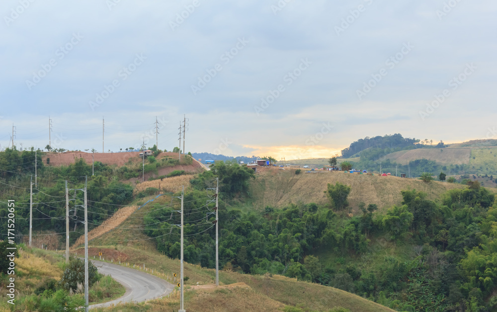 Fototapeta premium Sunset with mountain road.