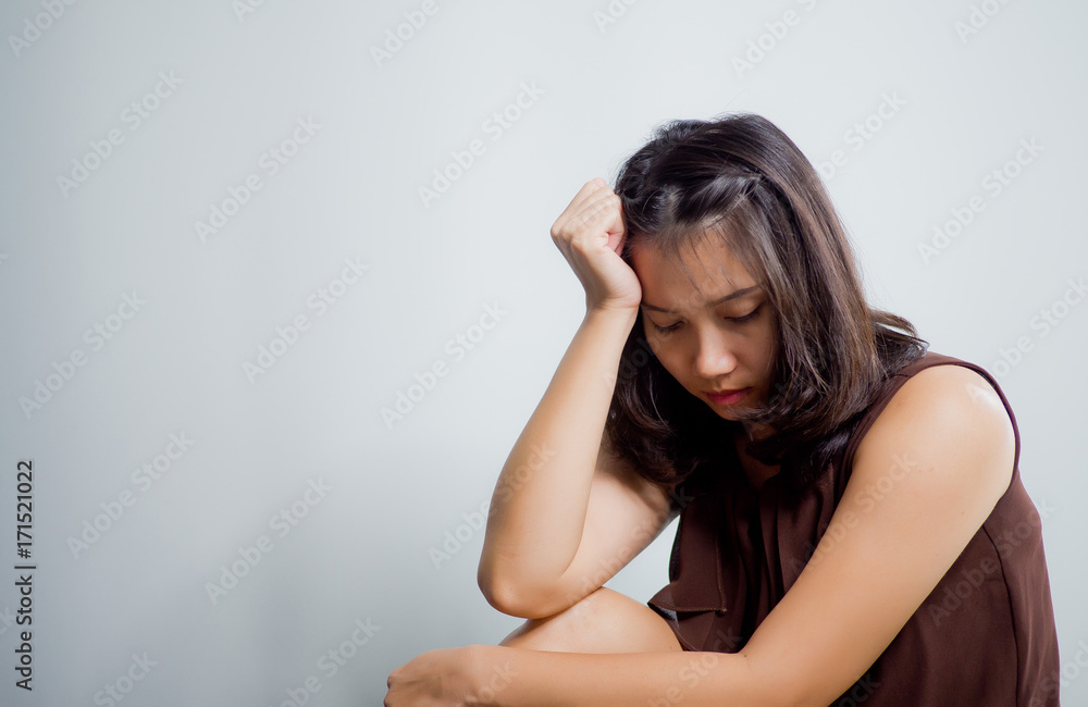 woman feeling sad at window . lonely