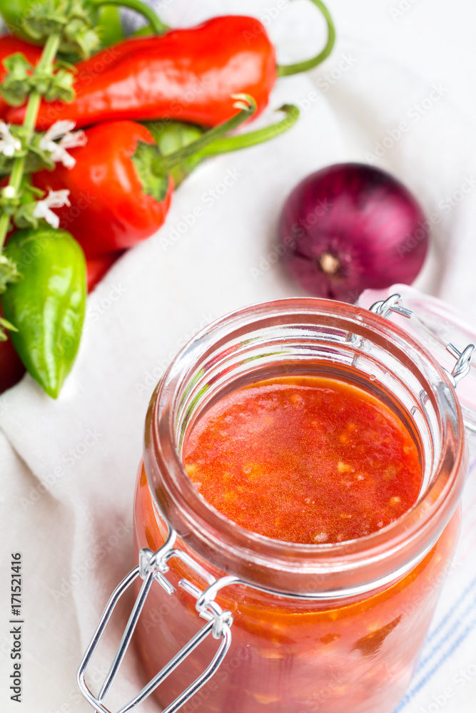 tomato sauce for pasta, hot pepper, basil and red onion closeup. tomato sauce for pasta, hot pepper, basil and red onion closeup.