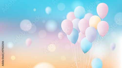 Bunch of colorful pastel balloons flying over bright sky