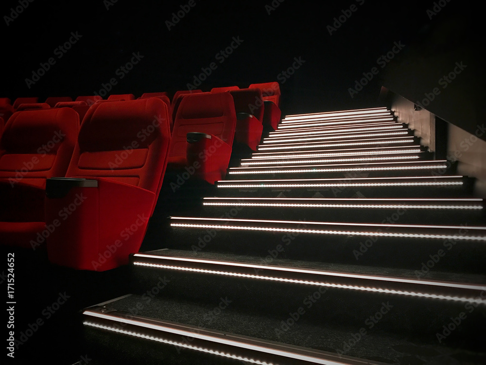 New unused movie theater seats and stairs with led lights. Stock Photo