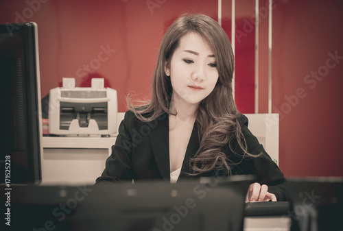 Asian business girl working with computer in the office. 