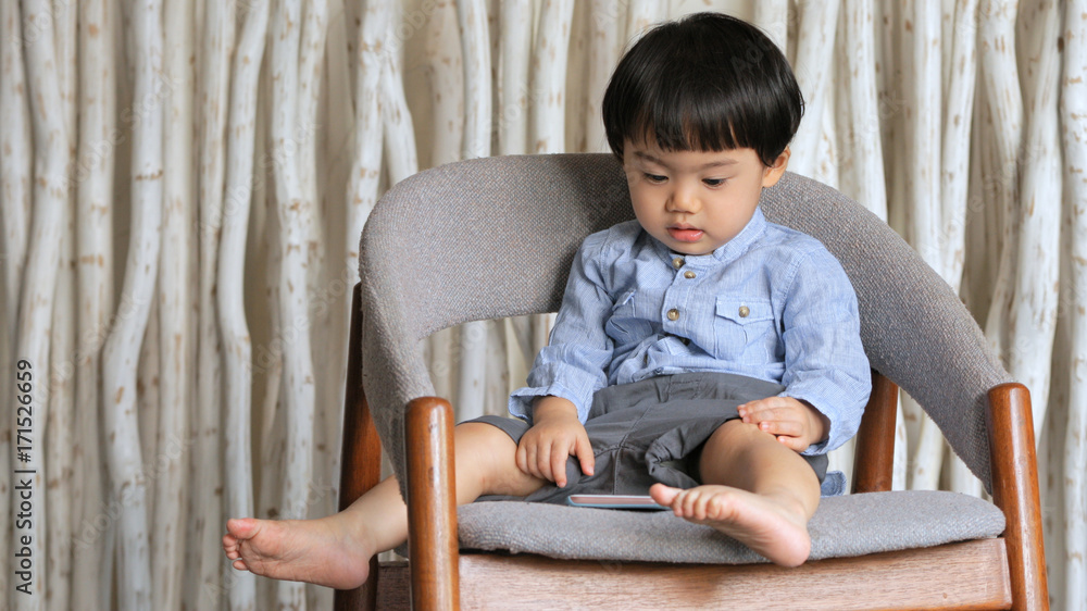 Baby boy watching on cellphone Baby boy watching on cellphone