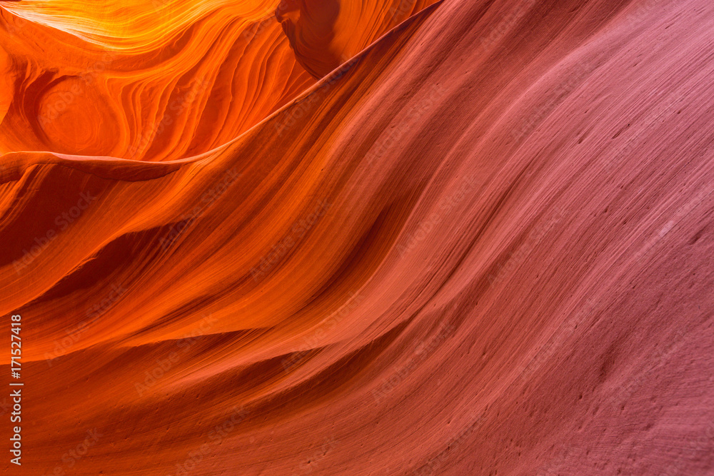 Beautiful, abstract, red rock shapes in Antelope Canyon, on a bright sunny day in summer Beautiful, abstract, red rock shapes in Antelope Canyon, on a bright sunny day in summer