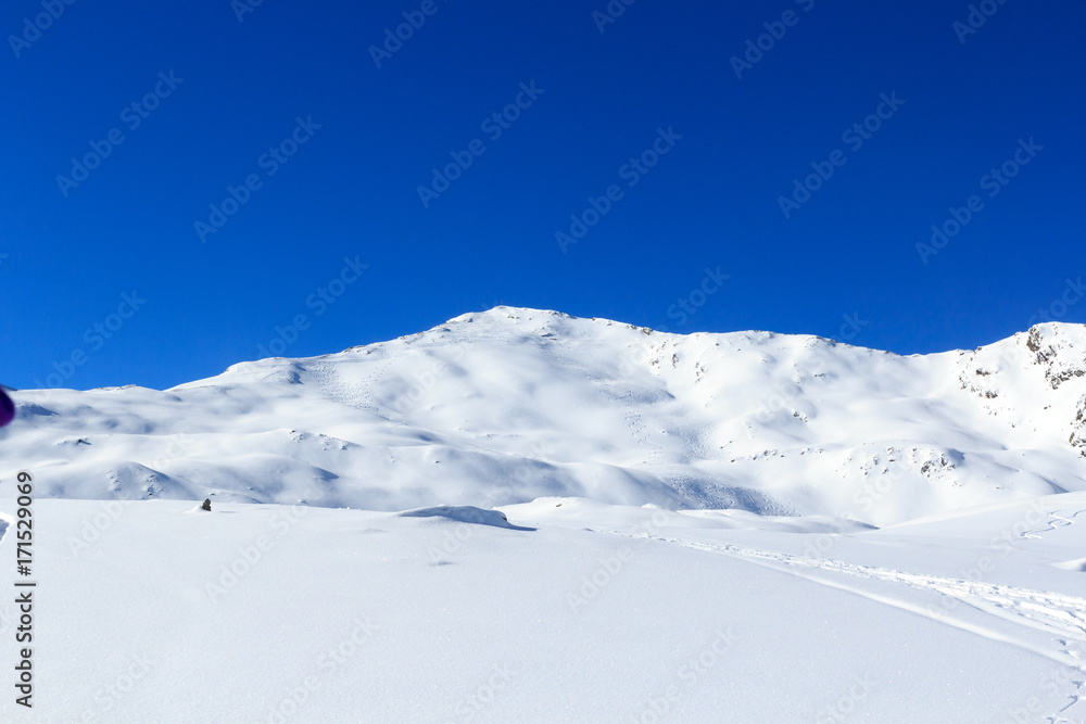 Mountain panorama with snow and ski tracks in winter in Stubai Alps, Austria