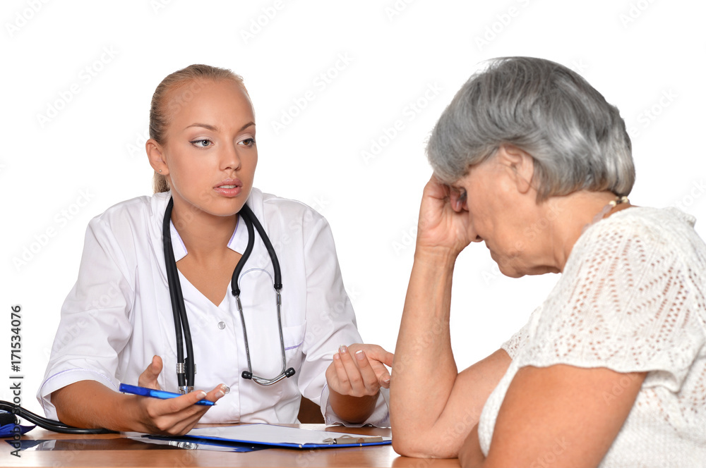 Female doctor speaking with senior woman Female doctor speaking with senior woman