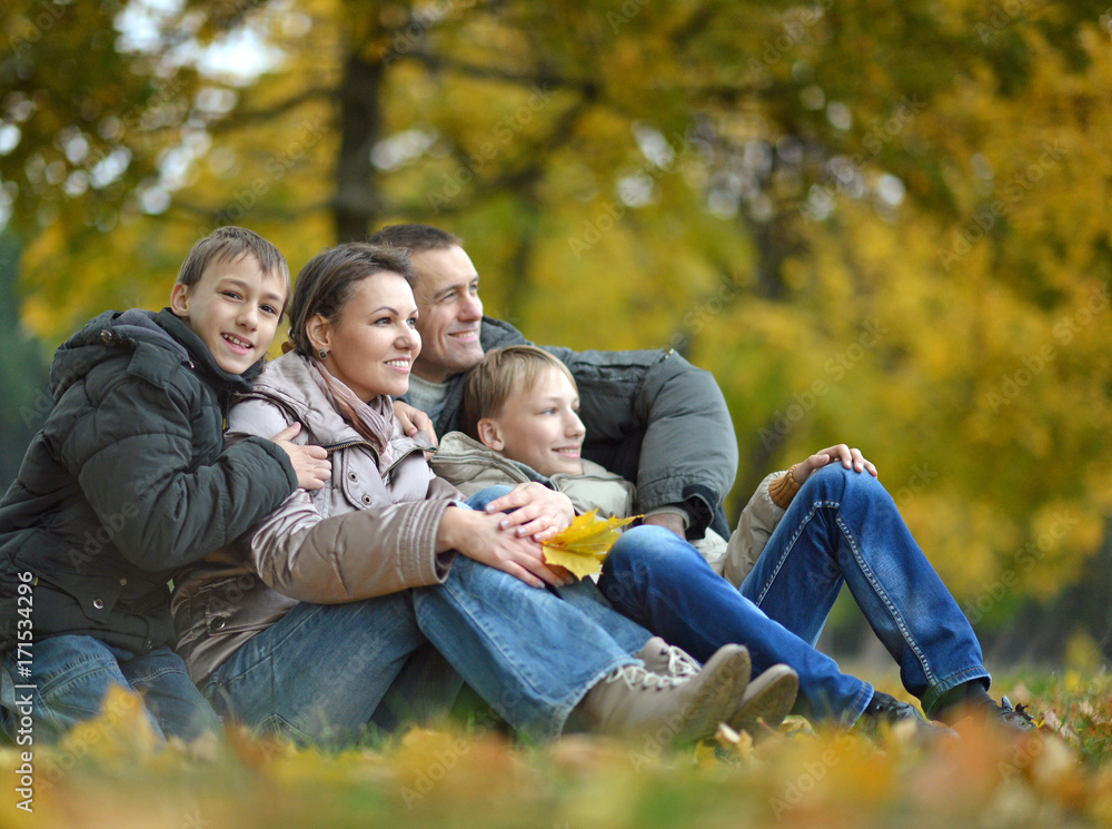 family posing in park family posing in park